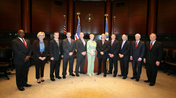 A group of people standing together in a row at the Badge of Bravery awards ceremony
