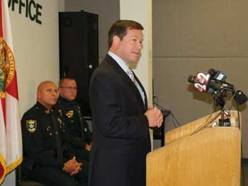A man giving a speech at the Badge of Bravery awards ceremony