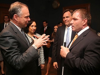 People conversing together in a group at the Badge of Bravery award ceremony