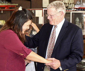 Two people at the Badge of Bravery award ceremony