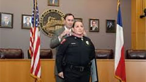 An officer being presented with a Badge of Bravery award