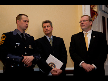 An officer being presented with a Badge of Bravery award