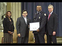 OJP AAG Regina Schofield, AG Alberto Gonzales, Firefighter Marvin Donaldson, and Associate AG Robert McCallum.