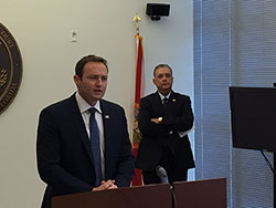 A man giving a speech at the Badge of Bravery awards ceremony