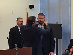 An officer being presented with a Badge of Bravery award