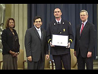 OJP AAG Regina Schofield, AG Alberto Gonzales, Fire Captain Phillip Atwood, and Associate AG Robert McCallum.