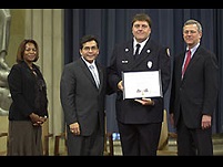 OJP AAG Regina Schofield, AG Alberto Gonzales, Fire Apparatus Operator Sean McKarnin, and Associate AG Robert McCallum.
