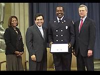 OJP AAG Regina Schofield, AG Alberto Gonzales, Firefighter David Bradley, and Associate AG Robert McCallum