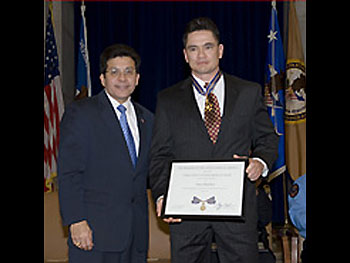 AG Alberto Gonzales and Officer Peter Alfred Koe.