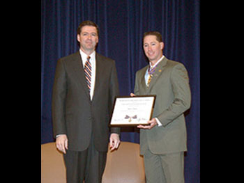 Deputy AG James Comey and Officer Barry Ralston.