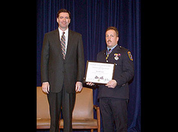 Deputy AG James Comey and Firefighter Kevin Fitzhenry.