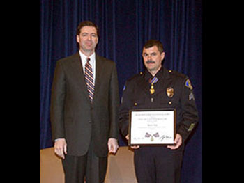 Deputy AG James Comey and Sergeant Marcus Young.