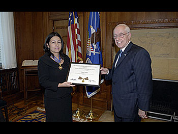 Maria Sentner, widow of Special Agent William Sentner, and AG Michael B. Mukasey.