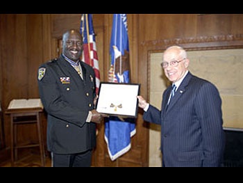 Lieutenant Carlos Thompson and AG Michael B. Mukasey.