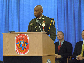 A man giving a speech at the Badge of Bravery awards ceremony