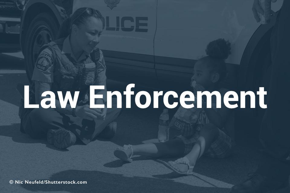Law Enforcement with background of female officer and child