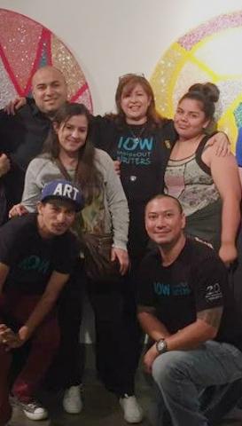 Jimmy Wu and Lorena Villanueva pose for a photo with IOW staff and students.