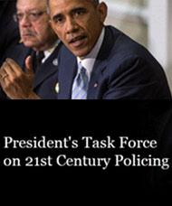 A poster showing a picture of Barack Obama and another man above the words "President's Task Force on 21st Century Policing"
