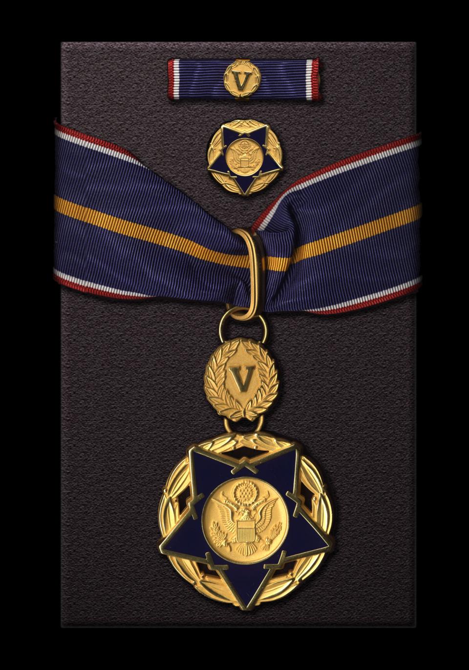 closeup image of a Medal of Valor award against a dark background